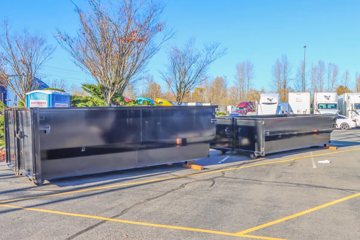 Professional dumpster rental service with roll-off container on residential driveway in Ukiah